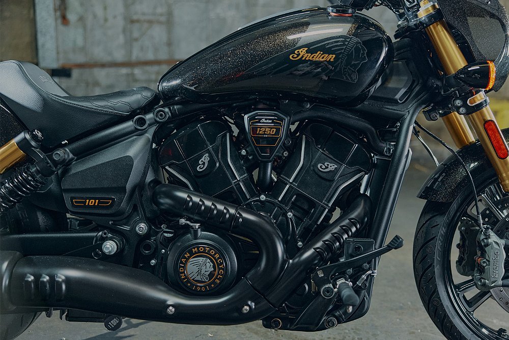 A close-up of the Sport Scout's black metal-flake painted tank and V-twin engine.