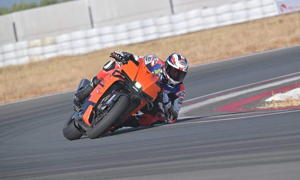 2026 KTM 990 RC R riding through a left-hand corner at a race track.