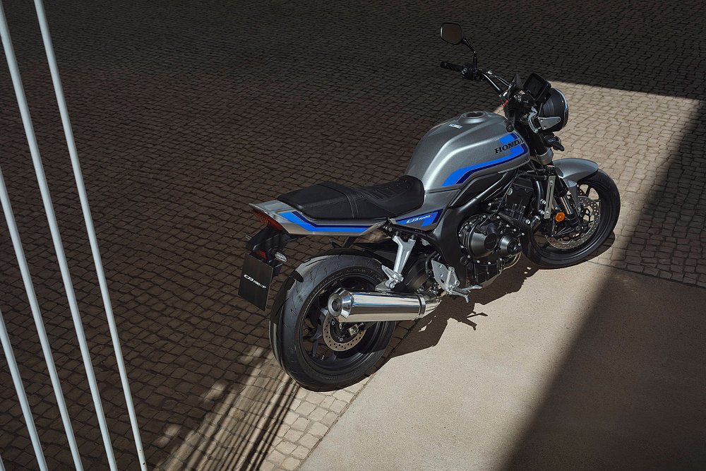 The Honda CB1000F retro naked bike staged in a cobblestone courtyard.