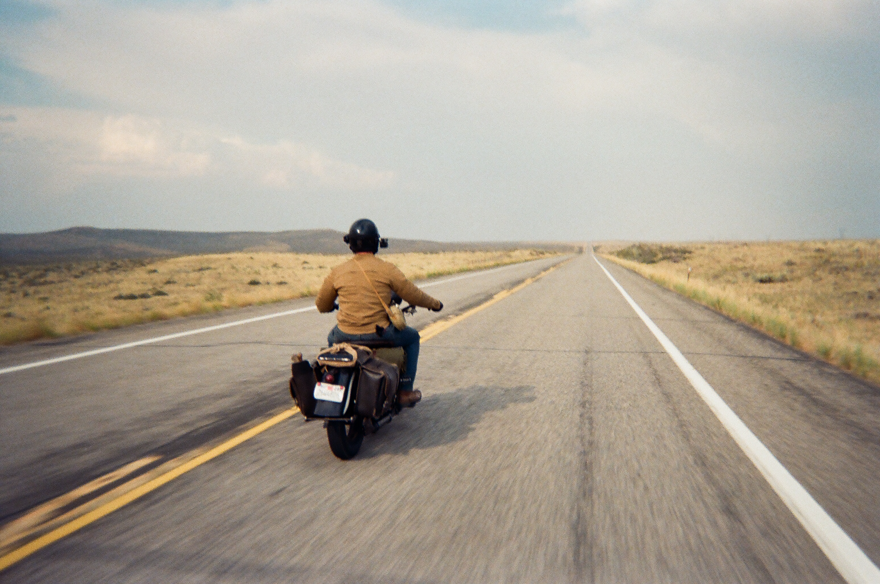 Ari on the Harley riding across the plains