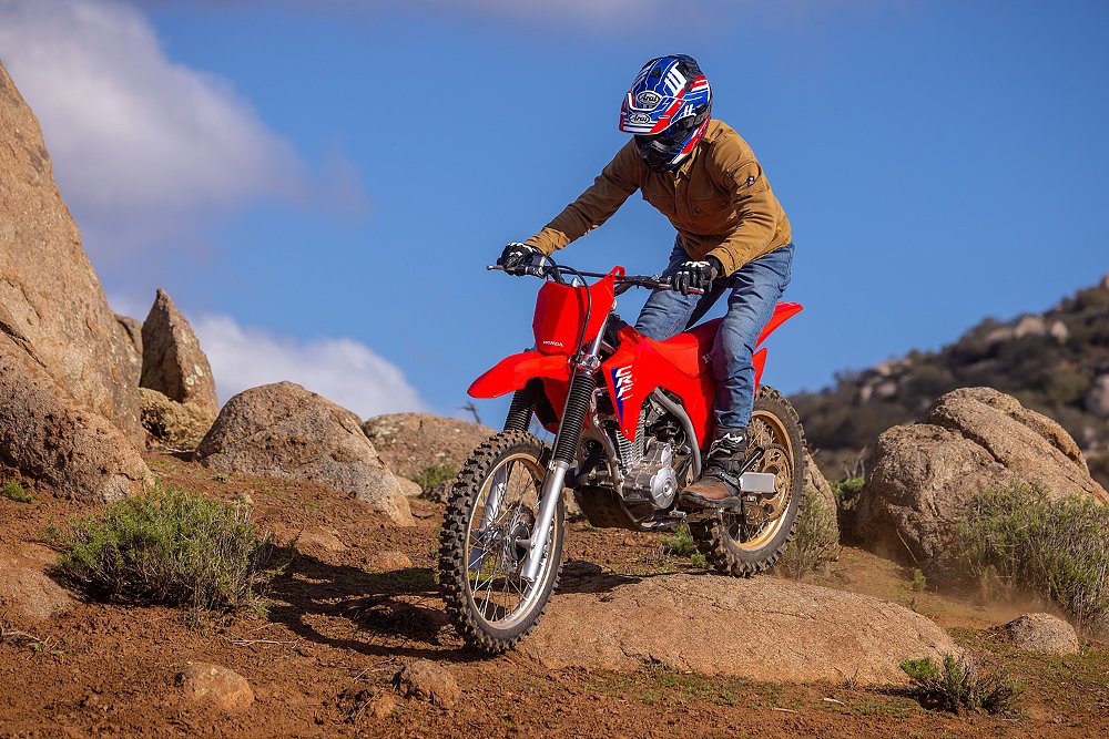 Dustin rides over rocks on the CRF300F.