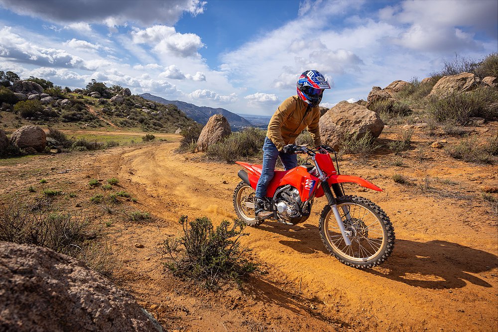 Dustin rides CRF300F on a sandy trail.