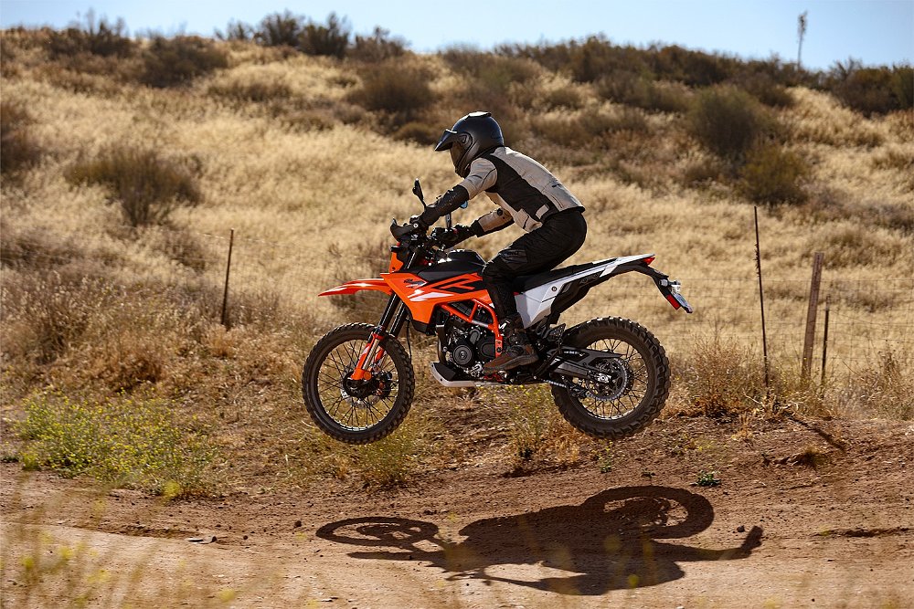 Dustin test riding the KTM 390 Enduro R and flying over a jump
