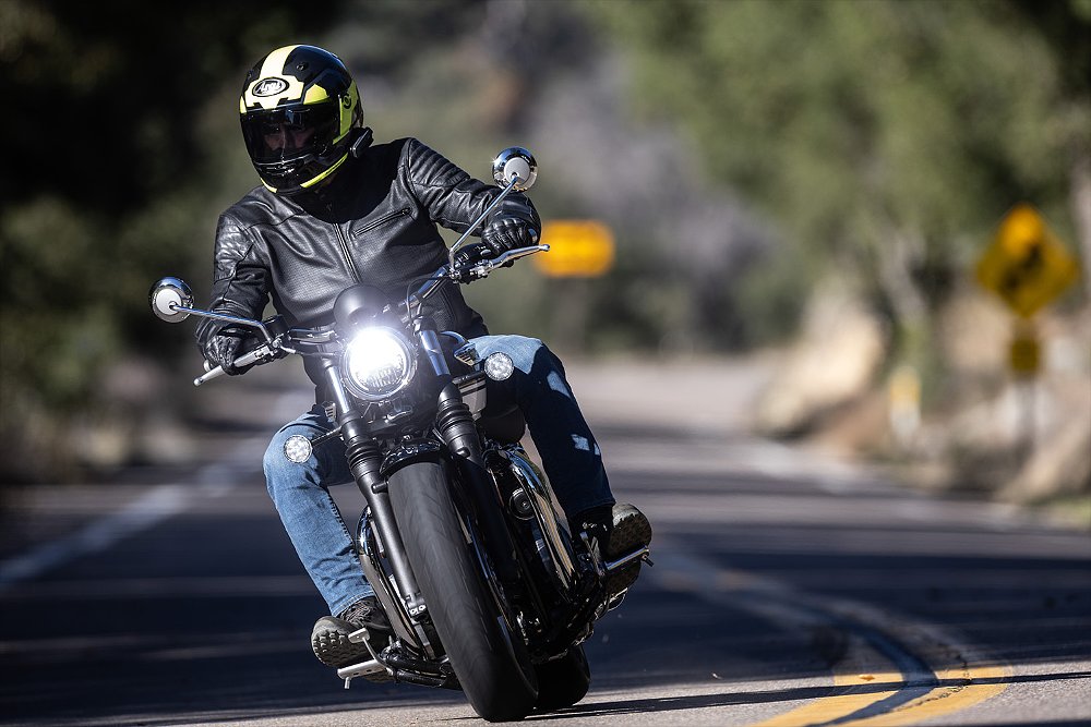 Dustin rides the Bonneville Speedmaster along a mountain road.