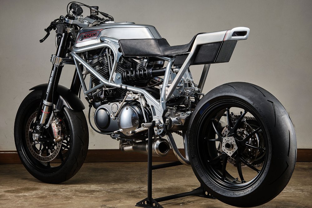 side view showing the horizontal mounting of the rear shock absorber and the open side of the single-sided swingarm