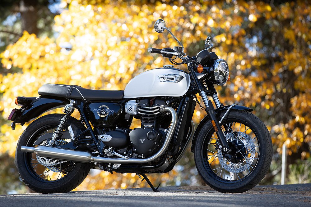 The T100 staged with fall foliage in the background.
