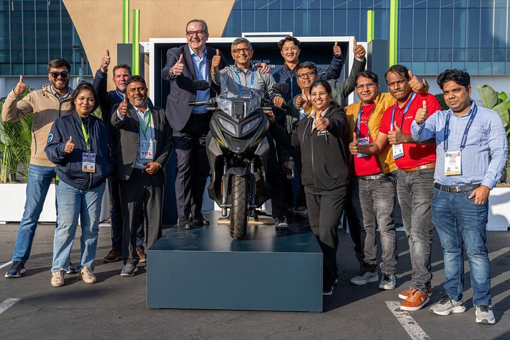 Valeo and Hero MotoCorp employees pose for a group photo outside the Valeo headquarters.