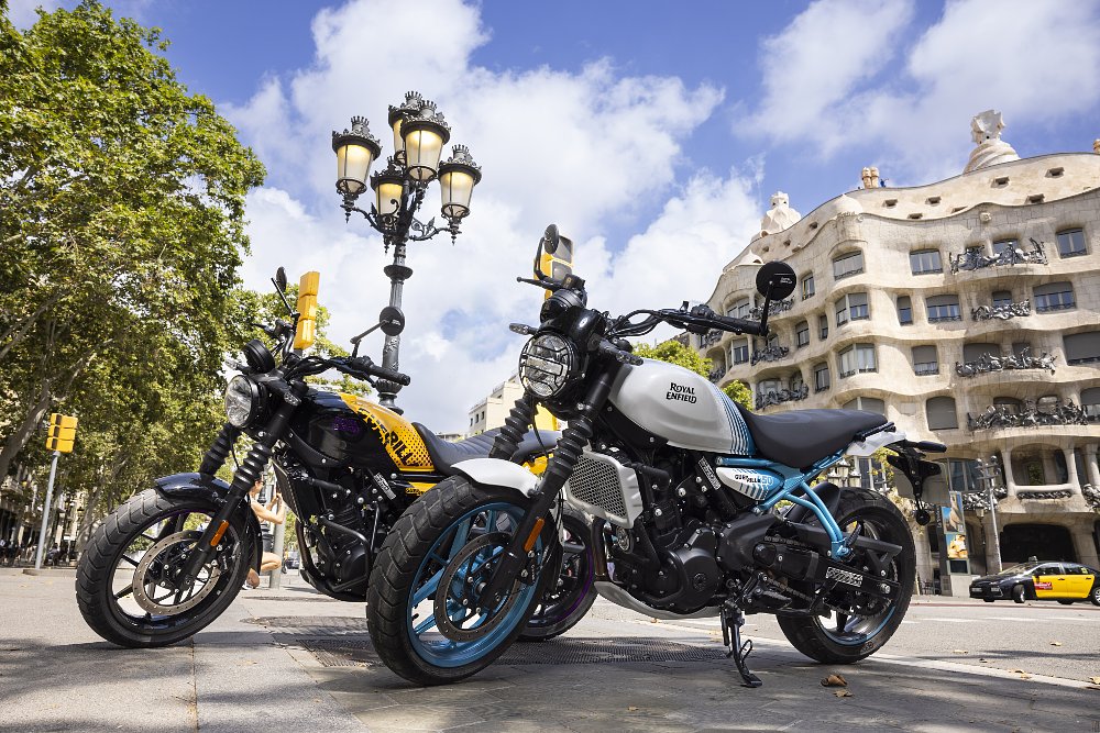 Dustin riding the Guerrilla on a hillside curve above the city of Barcelona