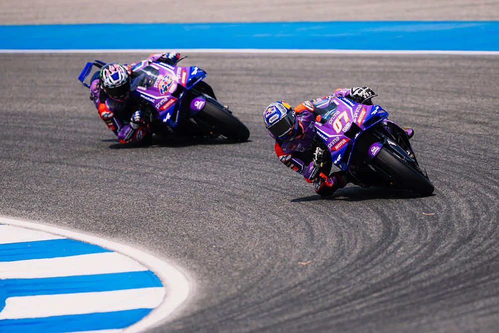 Toprak Razgatlıoğlu and teammate Jack Miller ride around the track together.