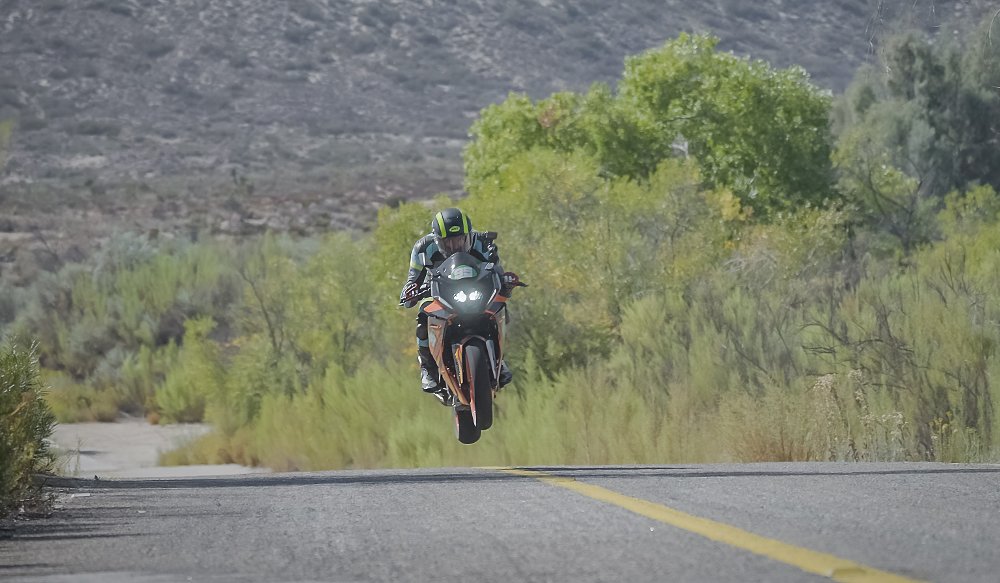 A KTM RC390 hits a jump on the San Pedro Martir Hill Climb course in Mexico.
