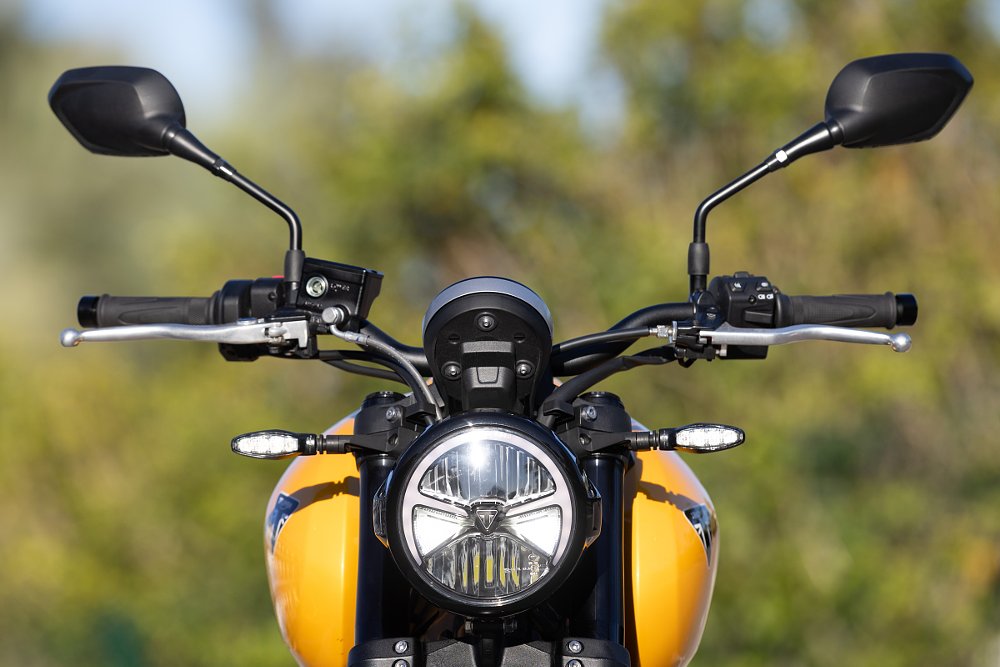 front view of the yellow Trident showing the round LED headlight unit