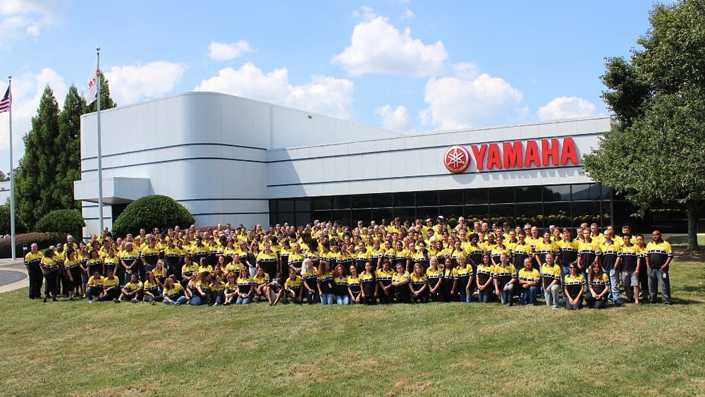 Yamaha employees pose in front of the brand's Kennesaw, Georgia, headquarters.