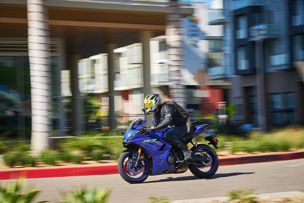 rider on the blue R7 on a city street