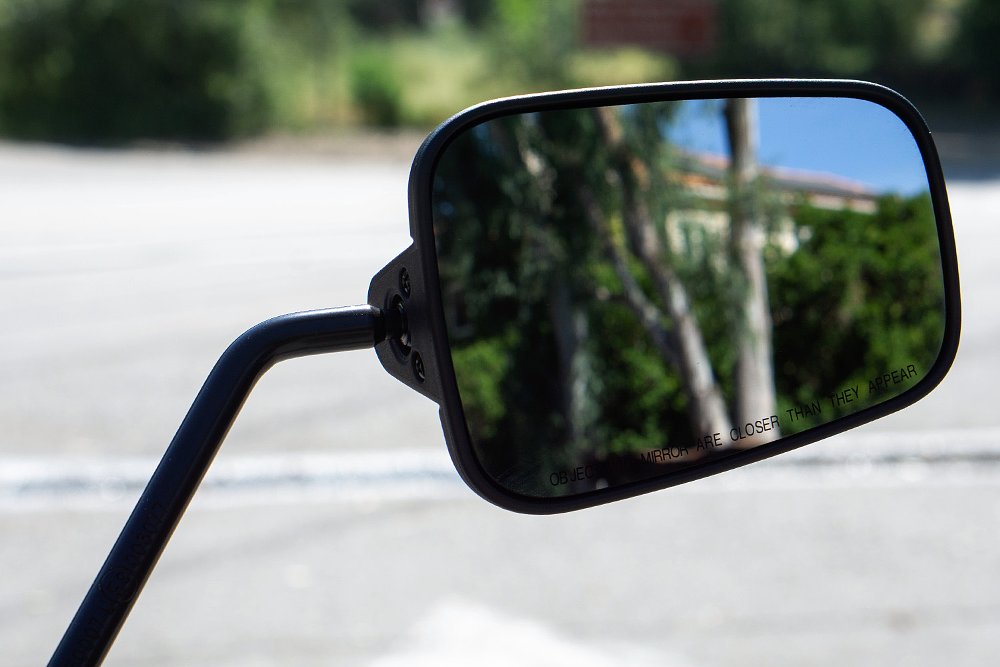 A close-up of the Pan America ST's side-view mirror.