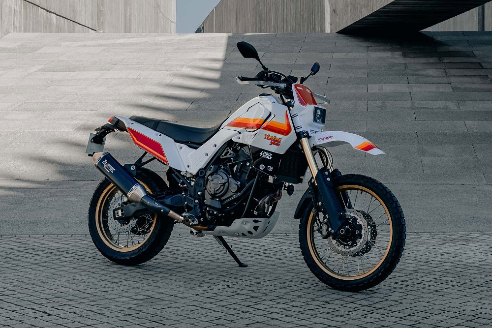 side view of the modified Tenere 700 with white bodywork and orange and red retro stripes