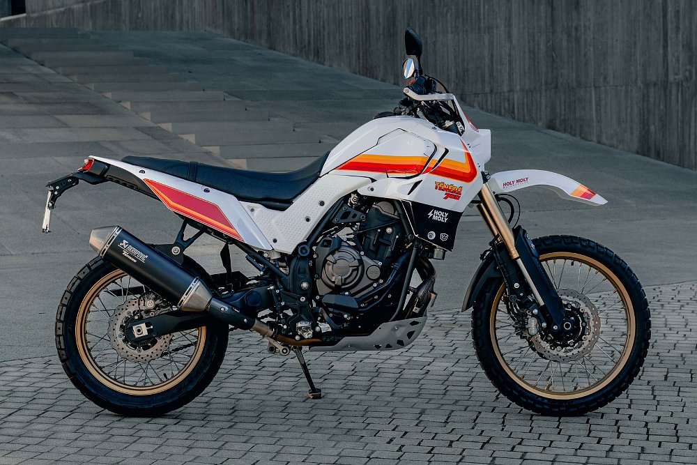 side view of the white custom with orange and red stripes