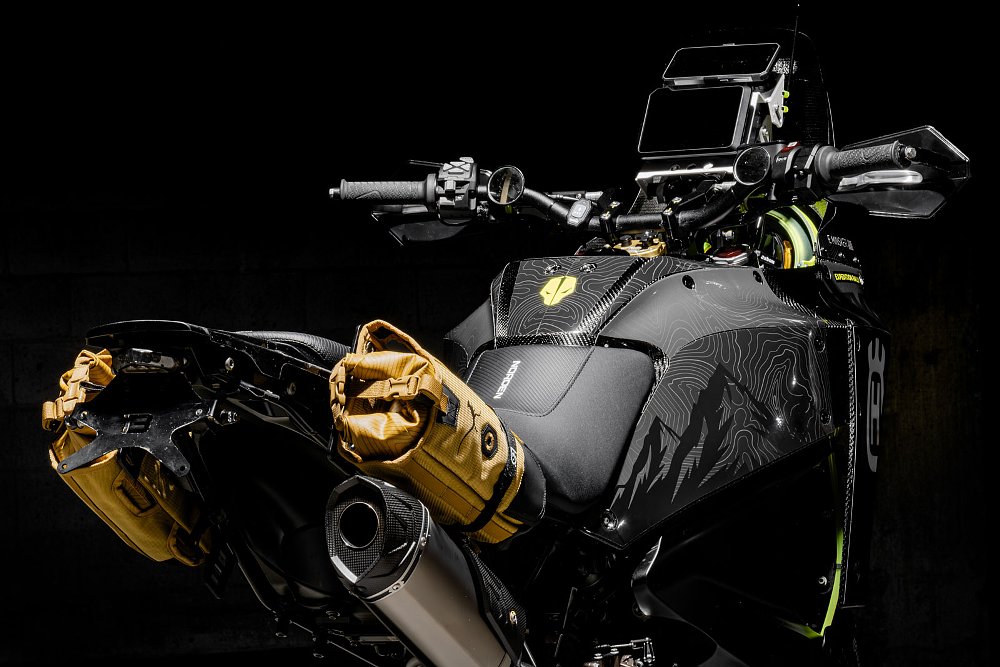 studio view of the side of the custom motorcycle, showing black bodywork with topo line design