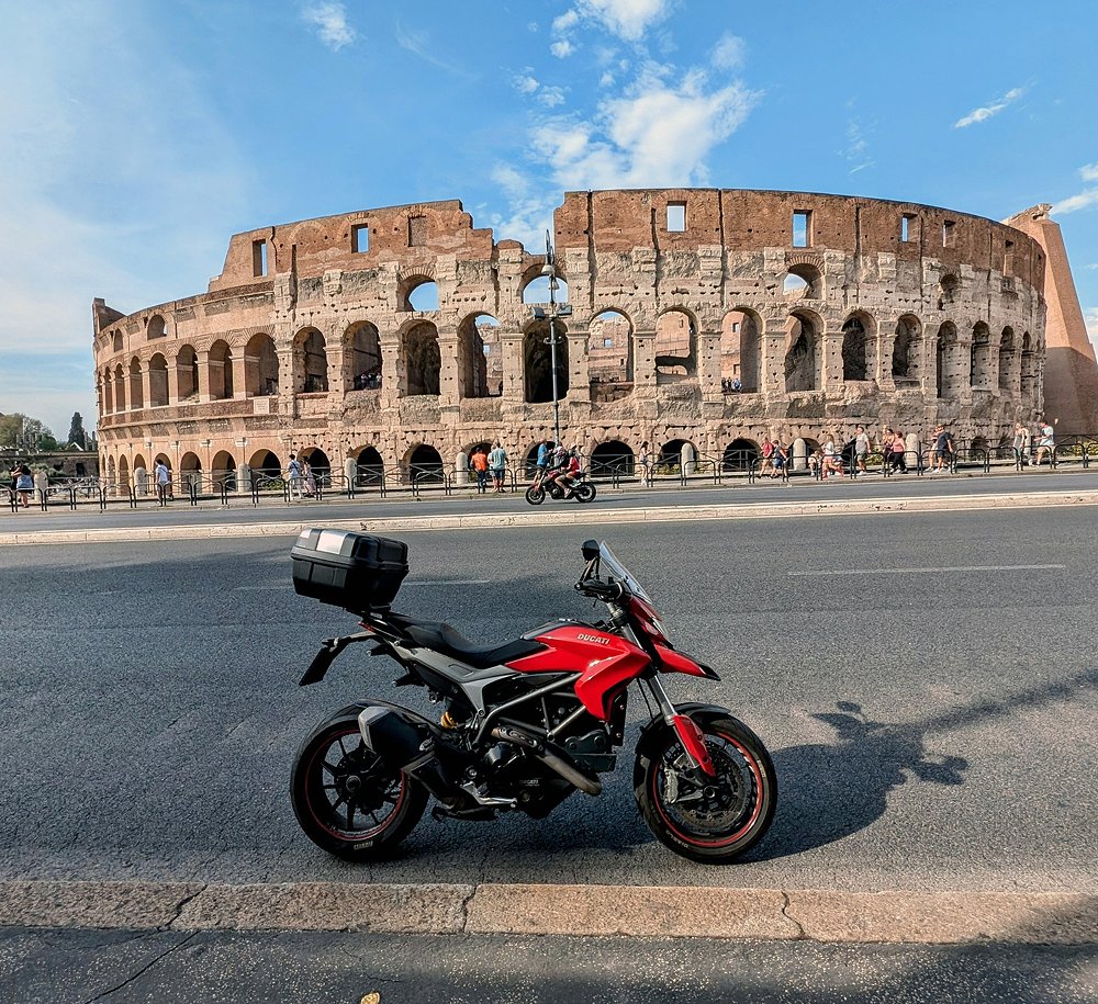 the red Hyperstrada with the ancient Coliseum in the background