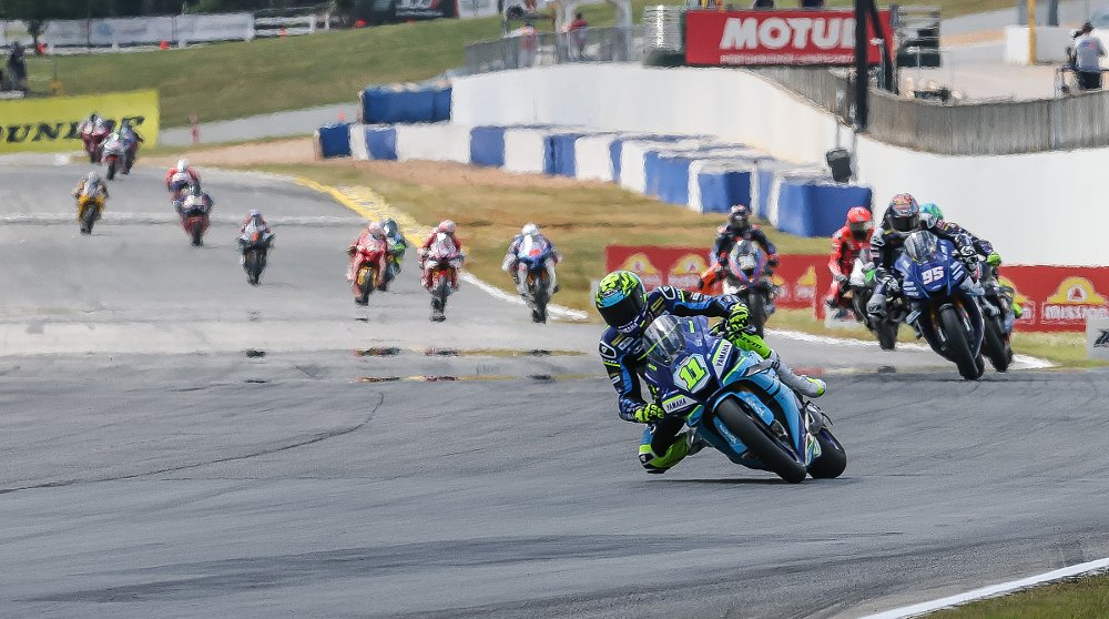 Scholtz on his blue and yellow Yamaha leads the field into turn one at Road Atlanta