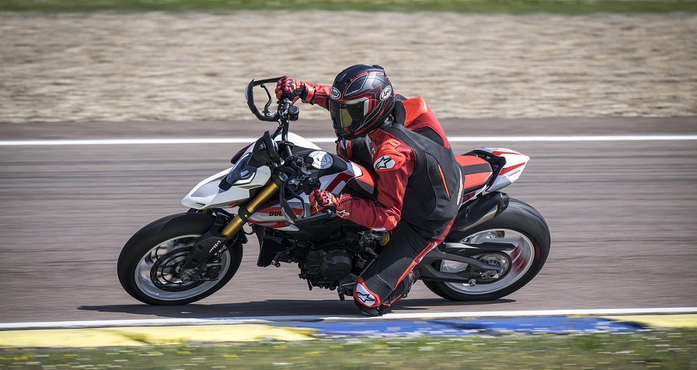 author riding the Hypermotard on the track