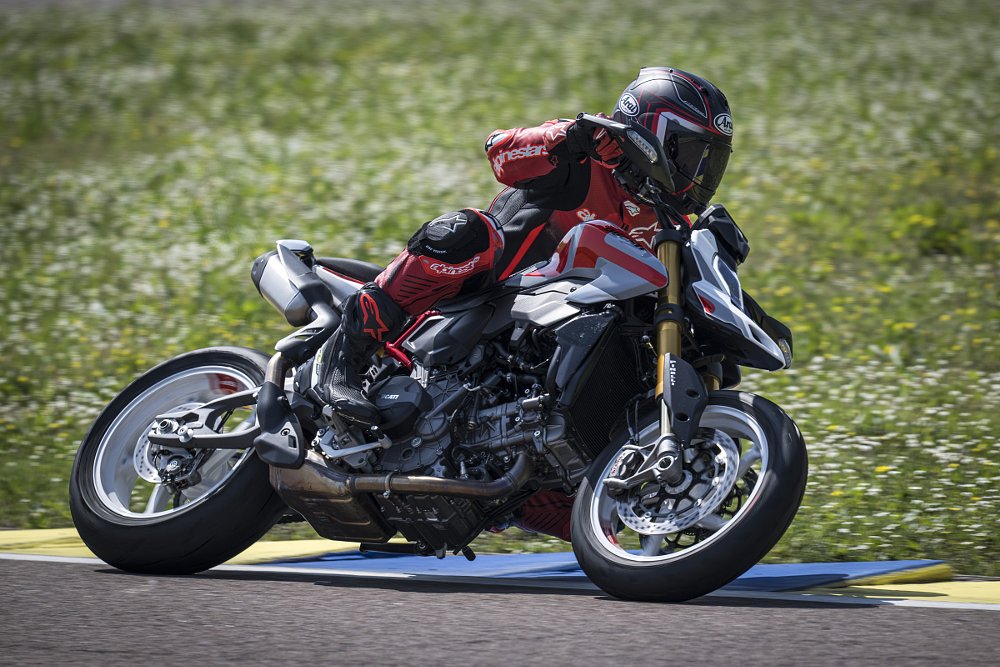 the author riding the Hypermotard on the track