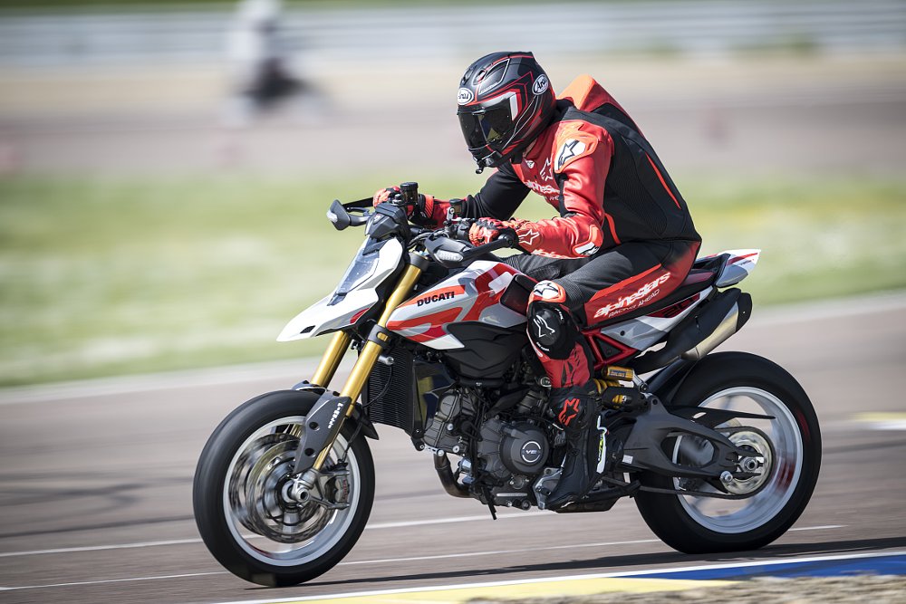 the author riding the Hypermotard on the track