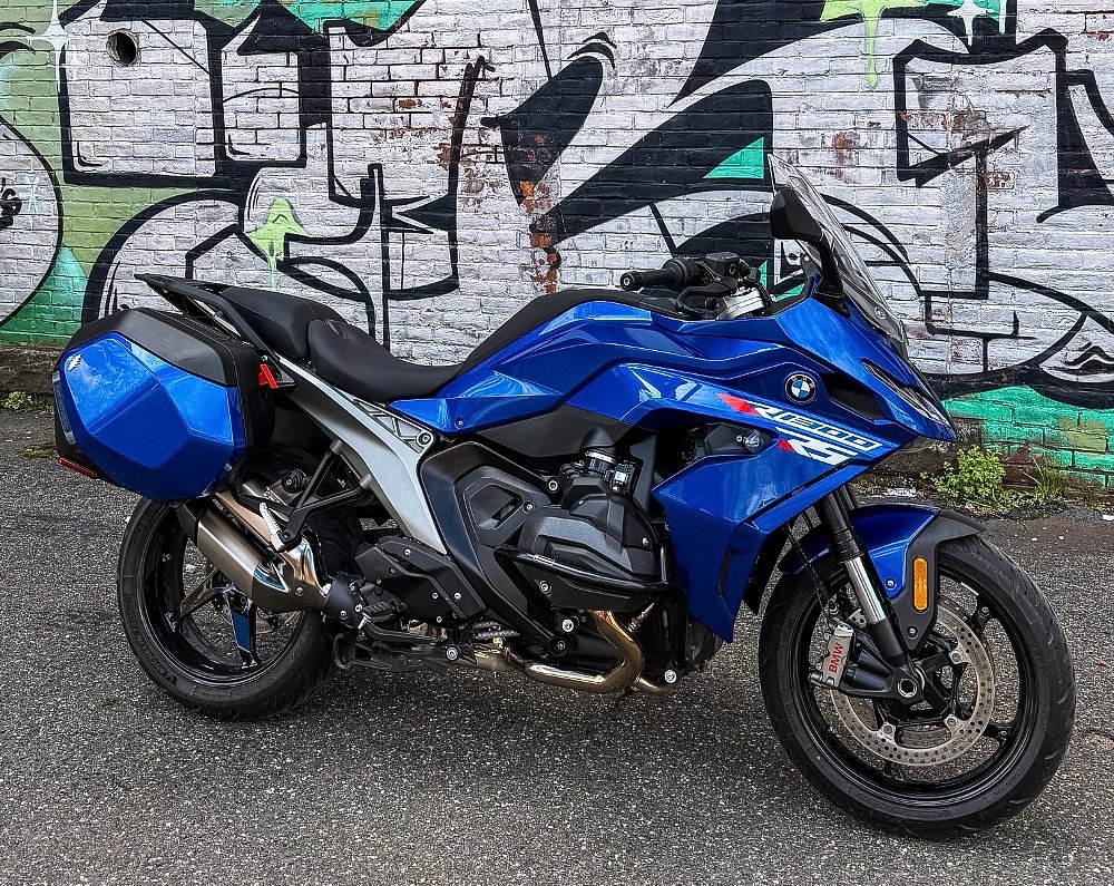 blue R 1300 RS parked in front of an urban mural
