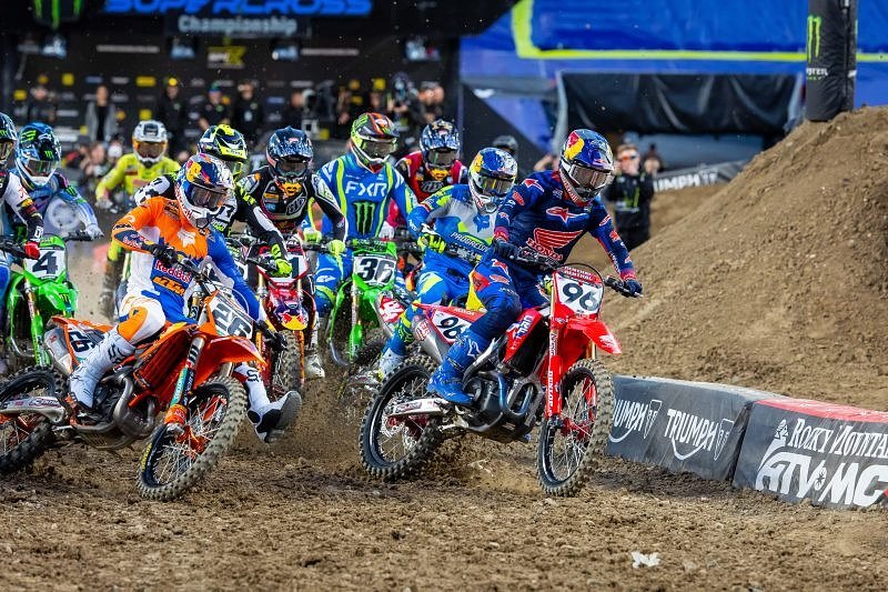 Lawrence on his Honda leads the pack into the first turn in the race