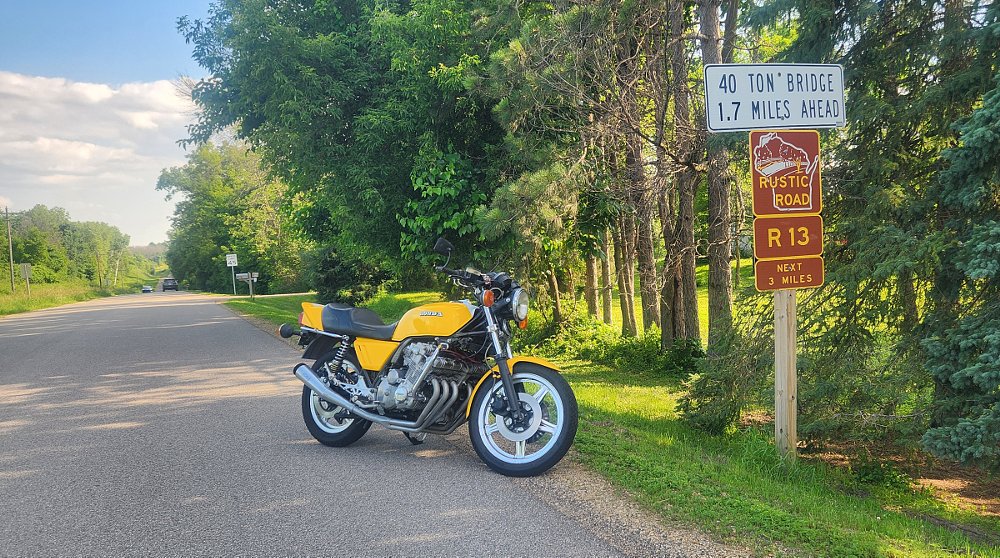 yellow Honda CBX parked alongside a designated scenic route in Wisconsin
