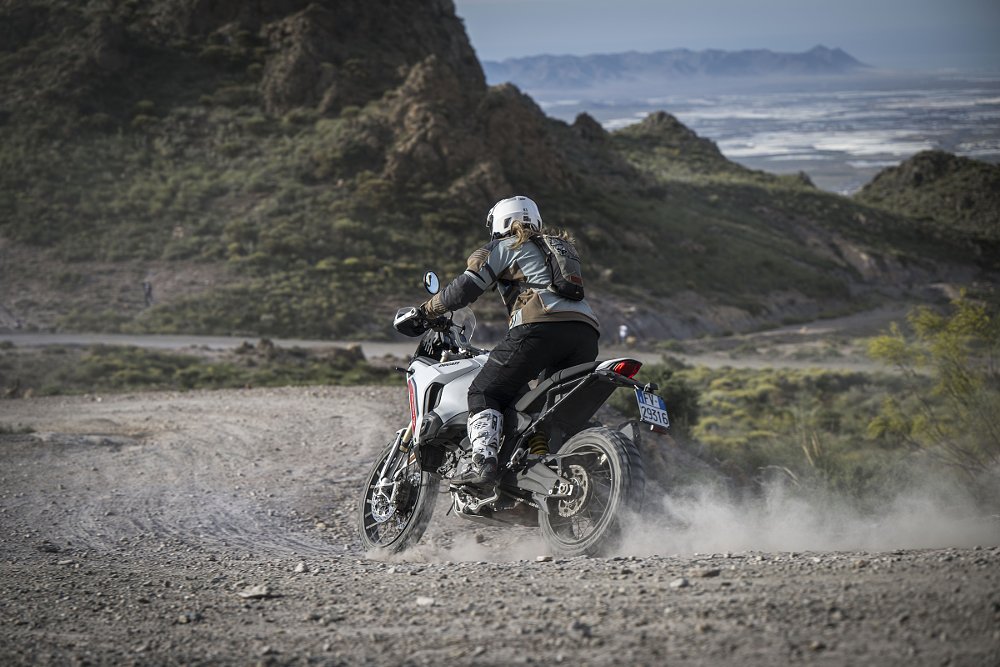rider on the DesertX on a rocky dirt road atop a mountain