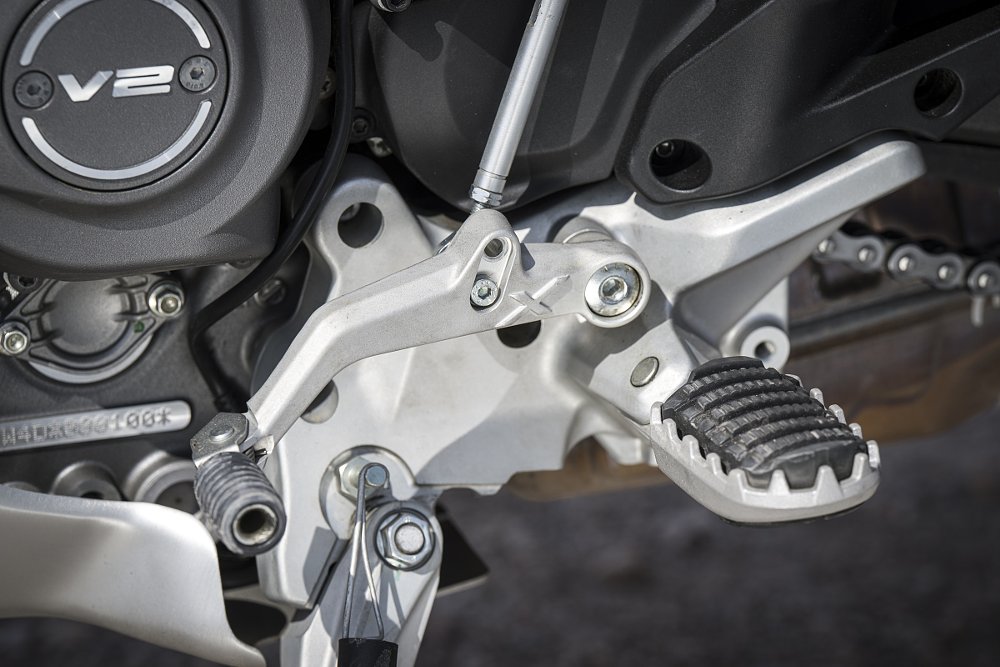 close view of the footpeg with removable rubber insert on a toothed metal peg