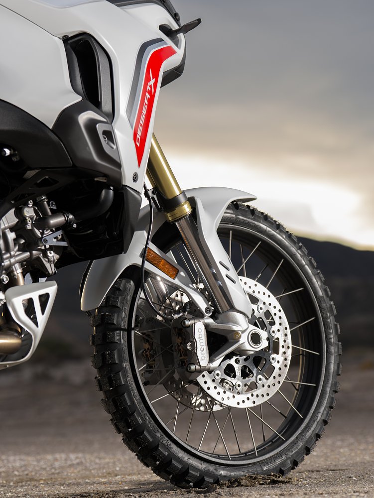 close view of the front wheel, brakes, and suspension