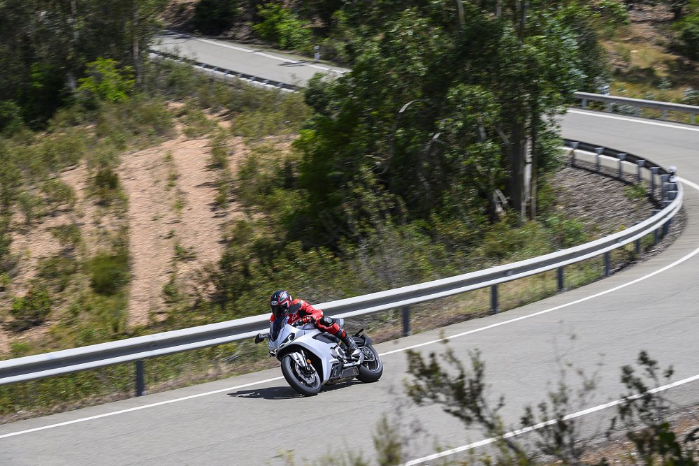 overhead view of the rider going through a curve on a mountain road in Spain