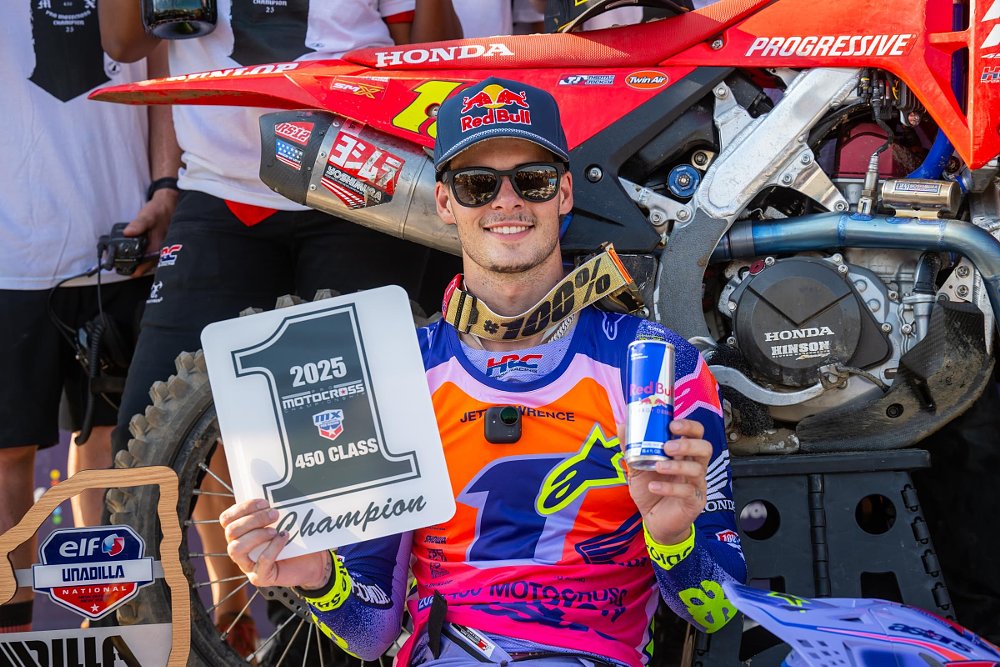 Jett Lawrence raises his 2025 Pro Motocross number one plate