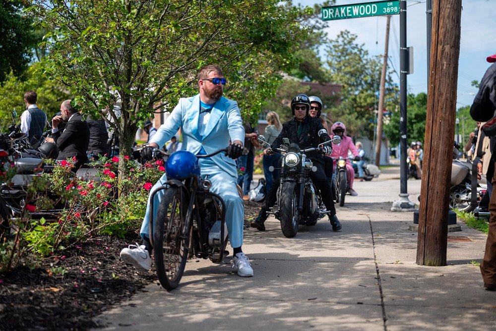 riders on the DGR ride wearing suits