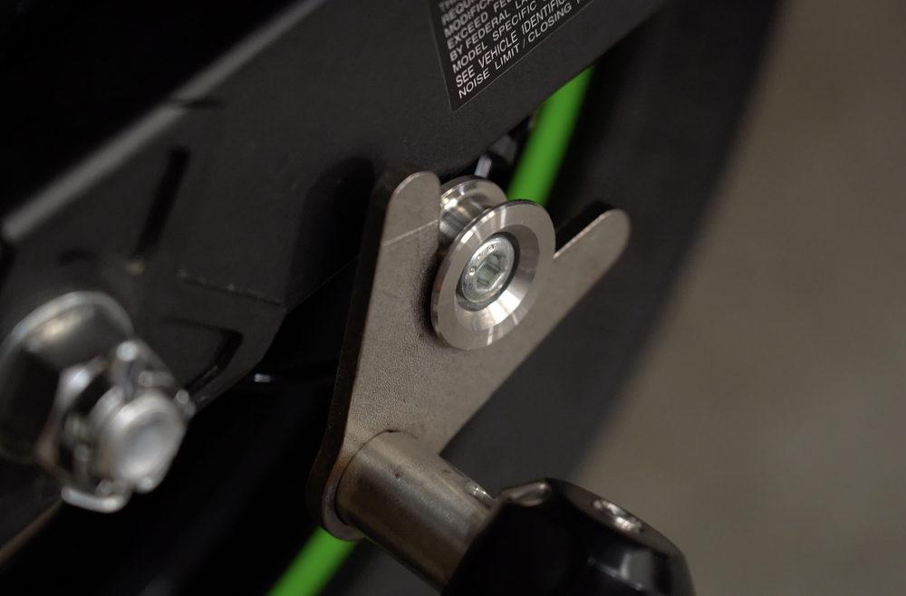 Swingarm spools on a motorcycle swingarm