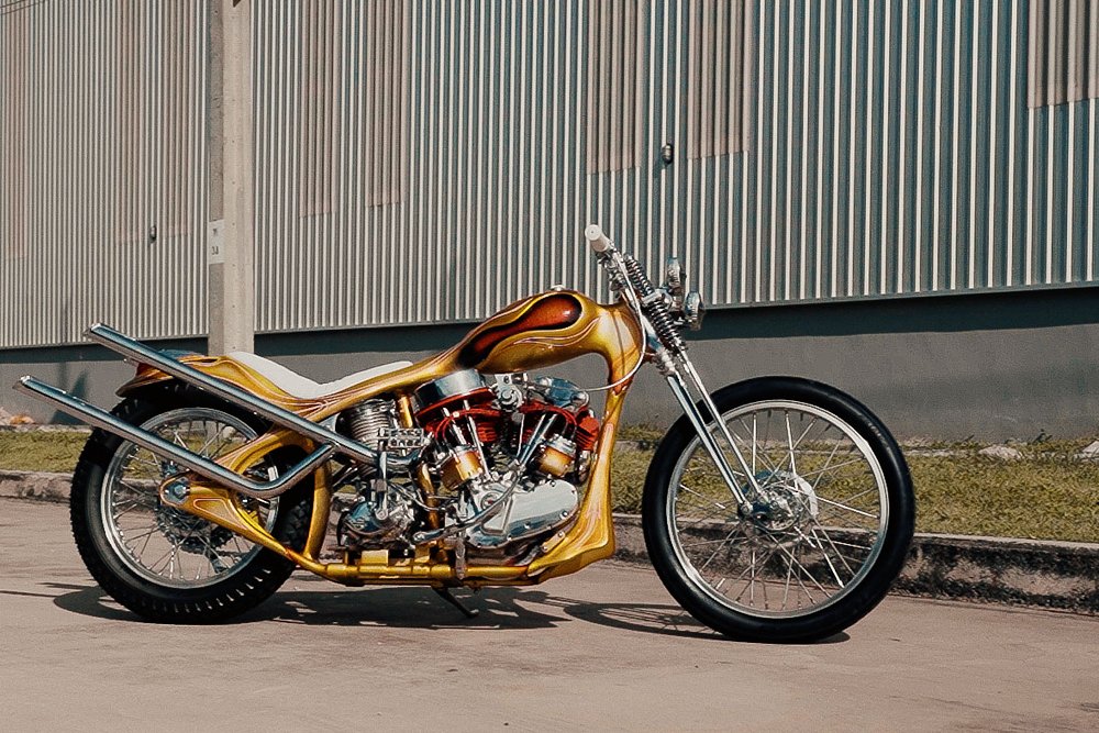 side view of the gold-painted custom chopper