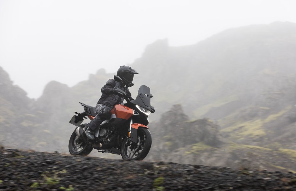 rider on the Atlas on a gravel road in fog