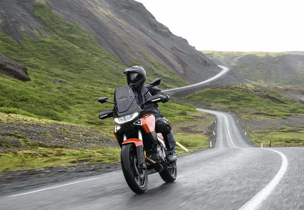 rider on the Atlas on a long road through barren hills