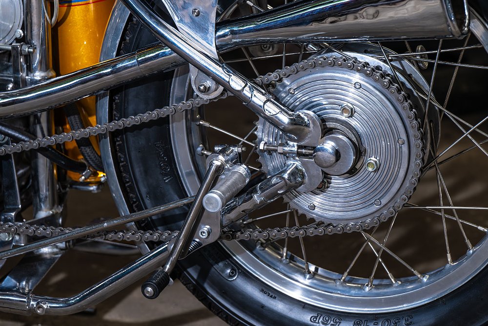 close view of the rearset footpeg near the rear sprocket
