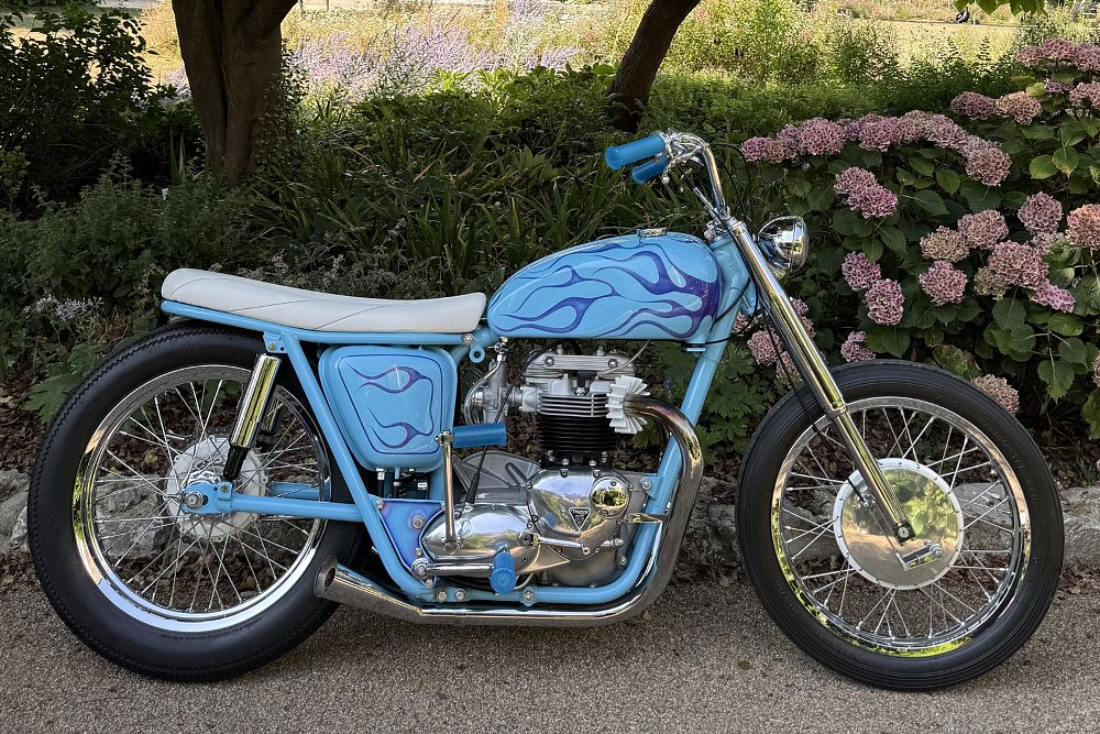 side view of the blue, white, and chromed custom Triumph