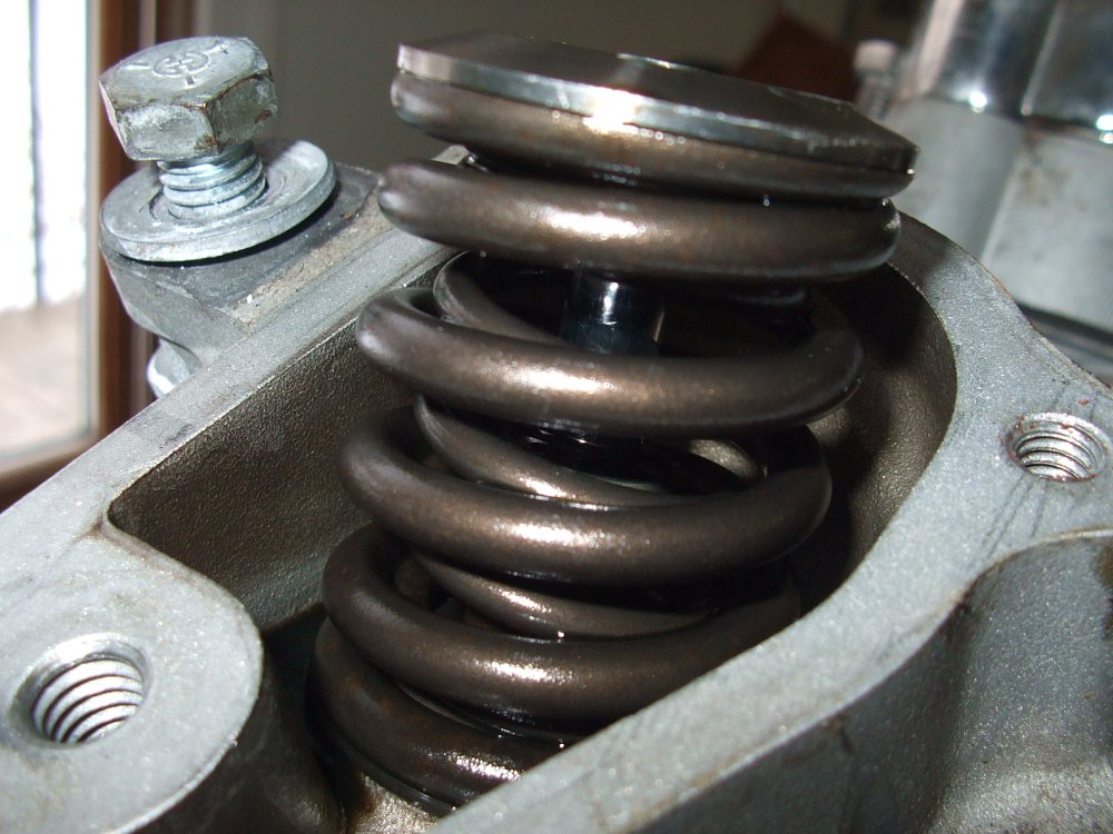 Why do so many bikes use shimunderbucket valve adjusters? RevZilla