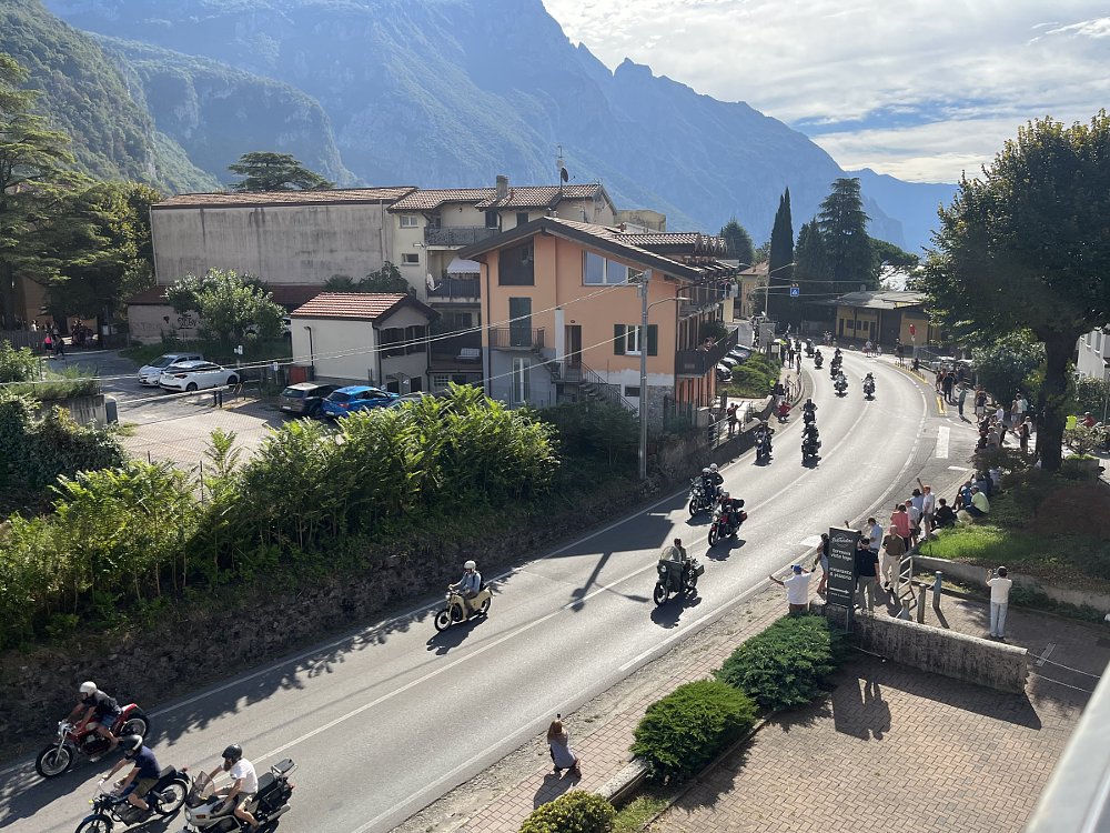 riders coming into the town on their motorcycles