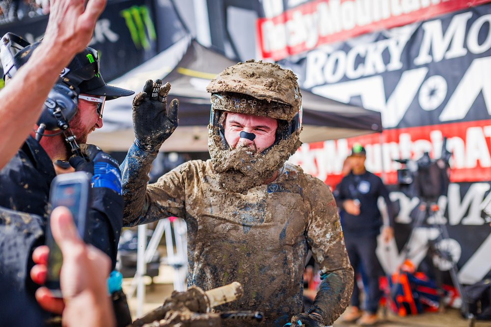 Deegan covered in mud after winning the motos