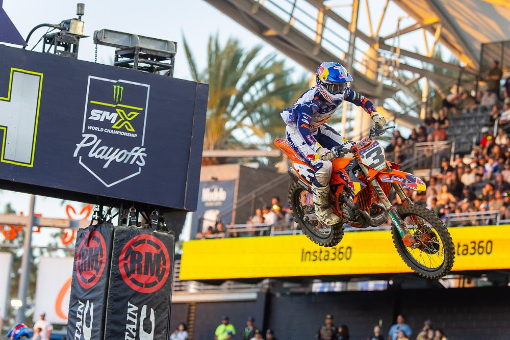 Eli Tomac flying through the air on his motorcycle across the finish line jump at SMX Playoffs round two