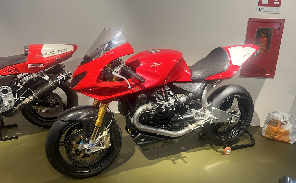 a red MGS 1 Corsa sport bike in the museum