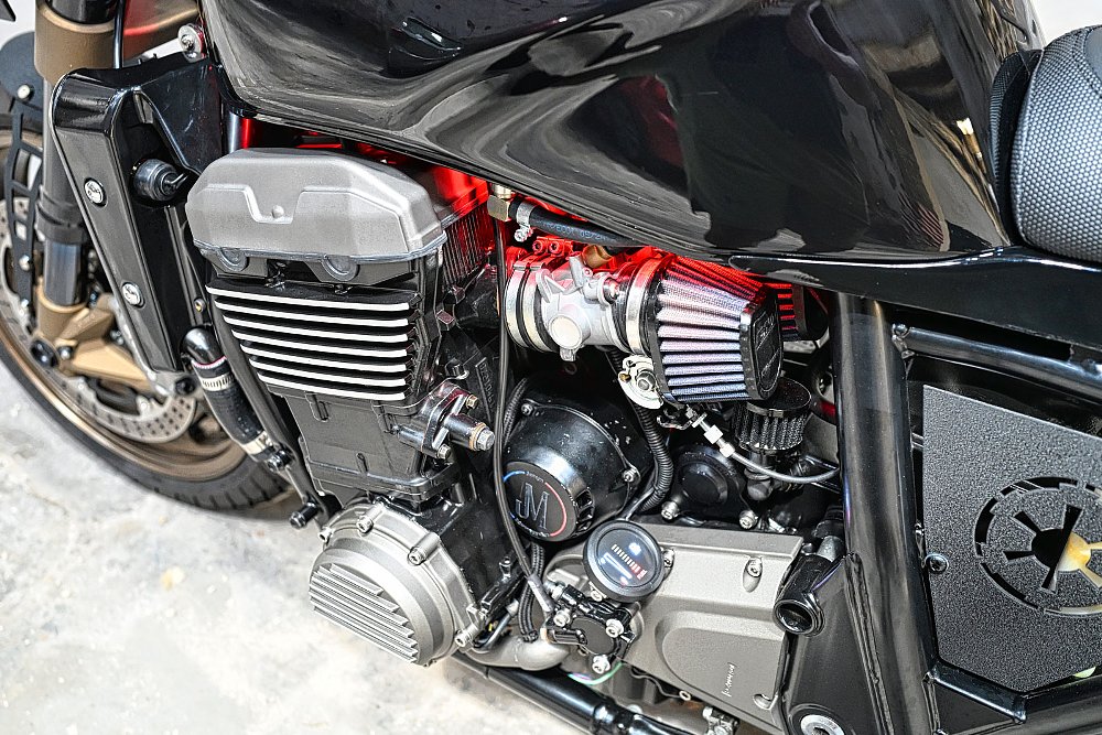 close view of the engine, lit up by red lights
