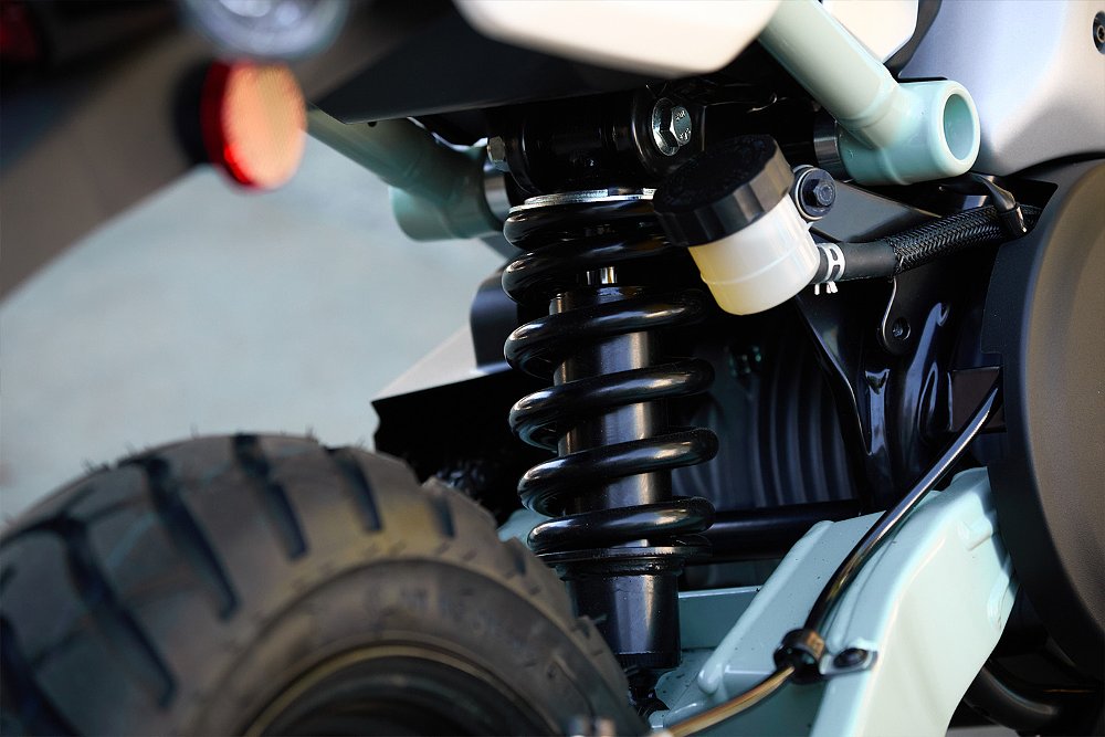 A close up of the Honcho Street's rear shock.