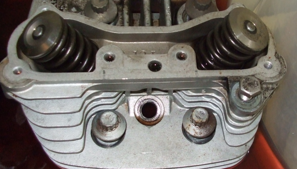 Why do so many bikes use shimunderbucket valve adjusters? RevZilla