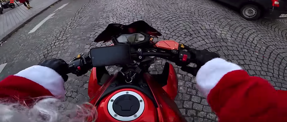 Video: Motorcyclist dressed as Santa catches hit-and-run driver
